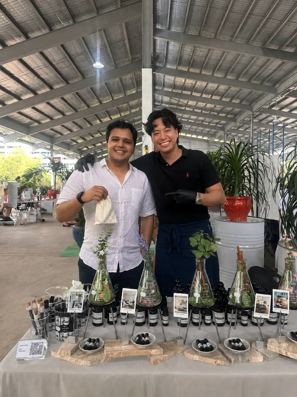 Akshay at a danhomme brand event, behind the product stall